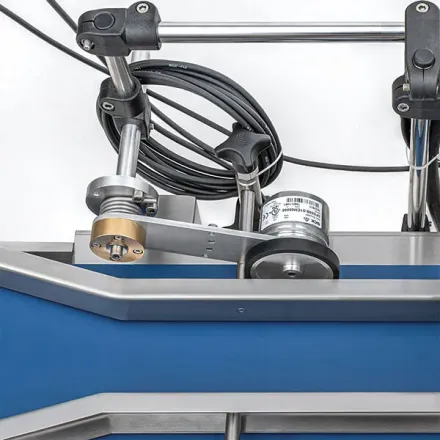 Shaft encoder mounted on a conveyor