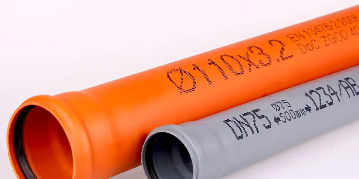 Extruded plastic pipes marked inline with product data and running metres